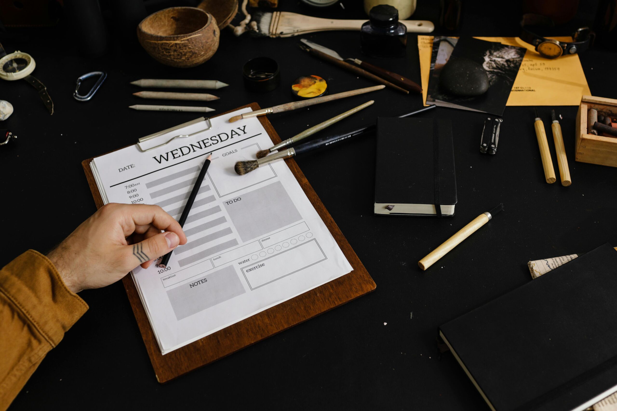 A cluttered desk with a prominent task list.