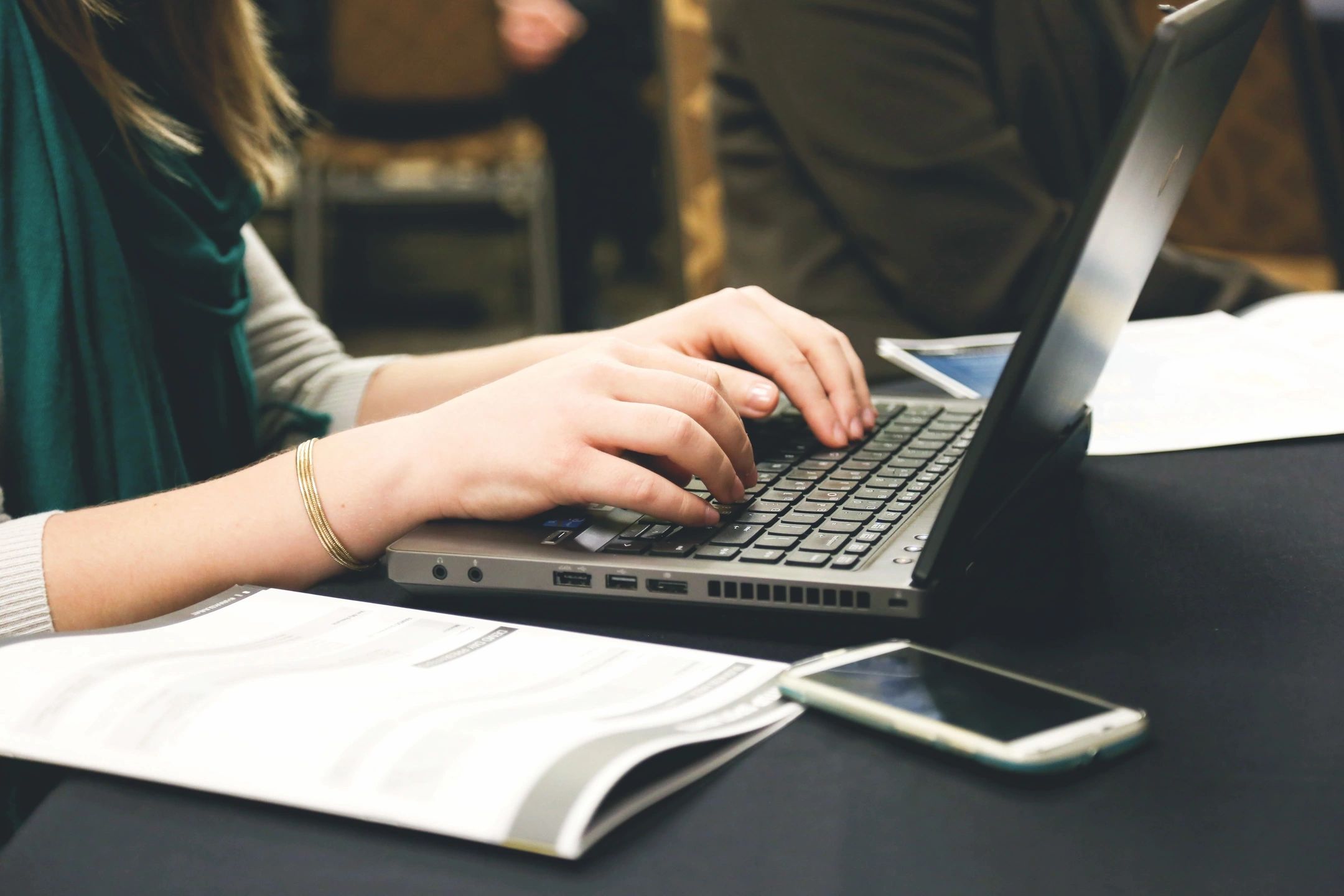 person typing on a computer