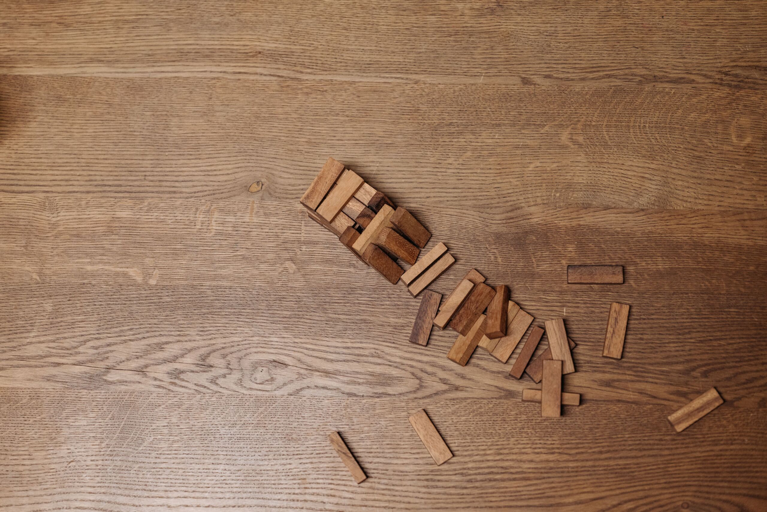 A broken stack of jenga pieces